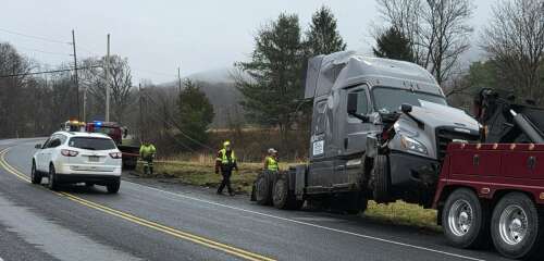 Truck snaps off pole, brings down power lines – Times News Online
