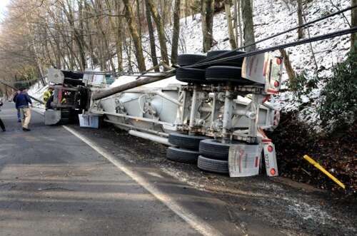 Tractor trailer rolls, takes down poles – Times News Online