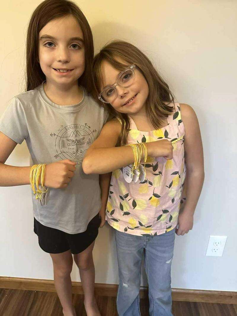 Bracelets raise funds to fight cancer Sisters take up cause after