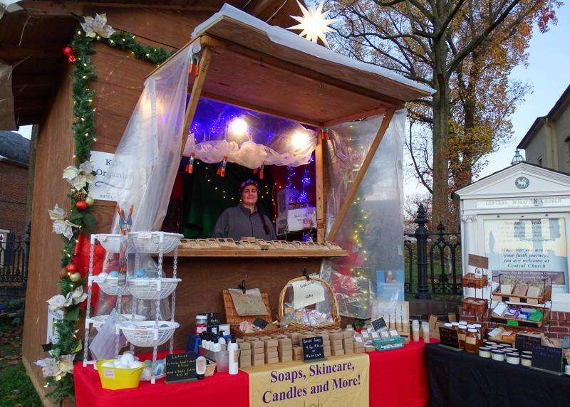 Huts on Main Vendors set up in charming, Christmasthemed wooden