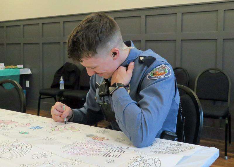 Emmaus patrol officer joins in the fun of Old Fashioned Christmas in