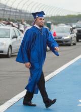 Jim Thorpe High School graduate James Adames walks along the track to receive his diploma during Thursday night’s graduation ceremnoy at Pocono Raceway.