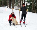Shannon McAward kneels with dog, Pax. Elissa Thorne, standing. said of the cross country skiing, "It was beautiful. The ice on top of snow made it fast."