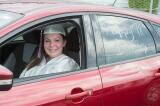 Dakota Schriner sits in her car at Jim Thorpe’s graduation ceremony at Pocono Raceway. Schriner also celebrated her 18th birthday on the same day.