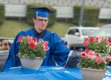 Colin Binder recives his diploma during Jim Thorpe’s graduation ceremony Thursday night at Pocono Raceway.