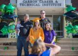CCTI graduate Angel Janulin, center, poses for a photo with her family, front from left, Sister Becky Ann Misskerg, step dad Robert Misskerg, mother Karen Misskerg and father Steve Janulin in the back row.
