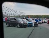 Students from the Jim Thorpe class of 2020 line up next to their vehicles for a group photo on the track at Pocono Raceway before their graduation ceremony.